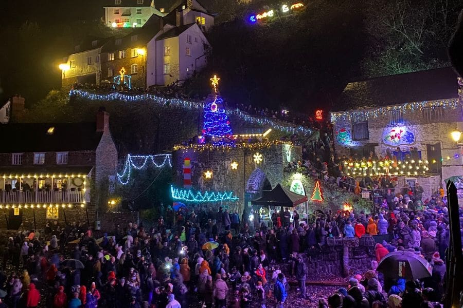 people watching the Christmas lights being turned on at Clovelly Quay